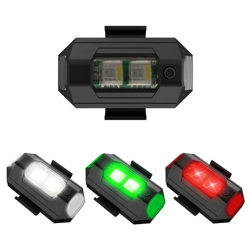 LED-stroboskopljus med 4 färger, USB-laddning, för fordon. Visas i regnbågens färger på svart bakgrund.
