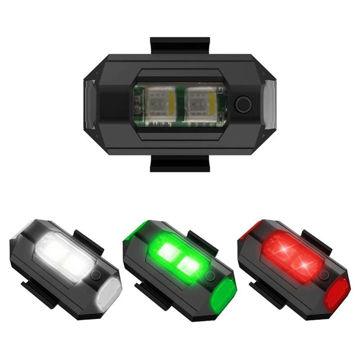 LED-stroboskopljus med 4 färger, USB-laddning, för fordon. Visas i regnbågens färger på svart bakgrund.