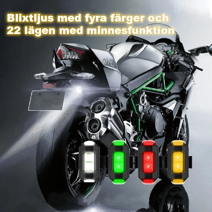 LED-stroboskopljus med 4 färger, USB-laddning, för fordon. Visas i regnbågens färger på svart bakgrund.