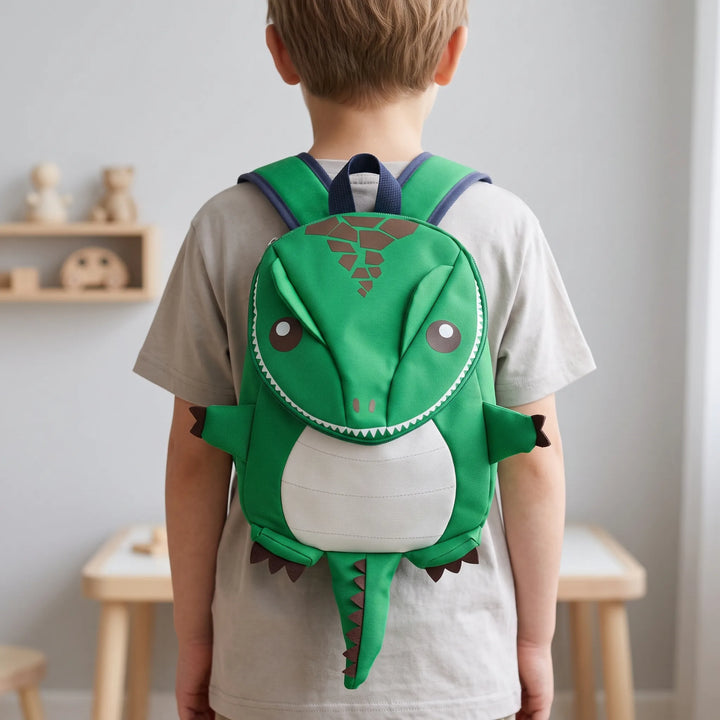 Lekfull barnryggsäck med 3D-dinosauriemotiv, perfekt för förskola och dagis.