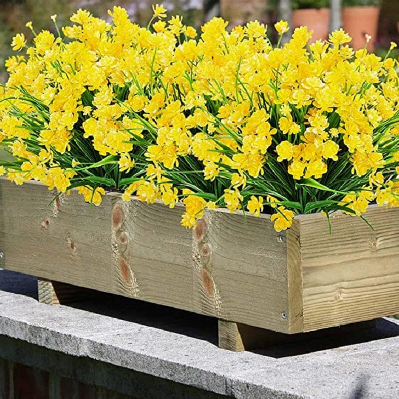 "Livfulla utomhus konstgjorda blommor med naturligt utseende i livliga färger, perfekt för enkel och elegant dekoration."