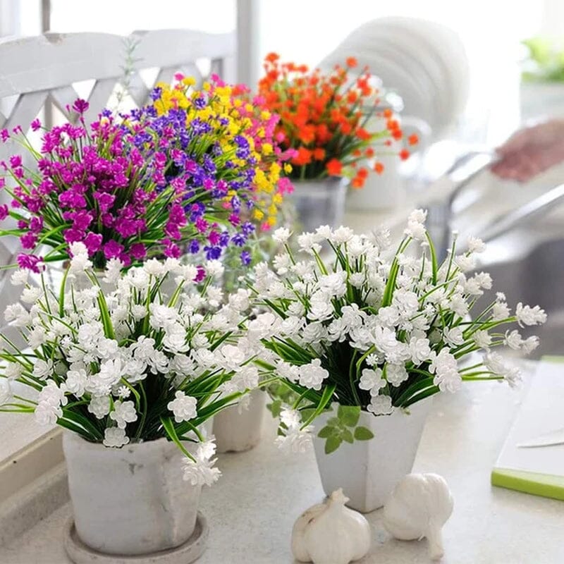"Livfulla utomhus konstgjorda blommor med naturligt utseende i livliga färger, perfekt för enkel och elegant dekoration."