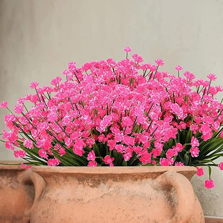 "Livfulla utomhus konstgjorda blommor med naturligt utseende i livliga färger, perfekt för enkel och elegant dekoration."