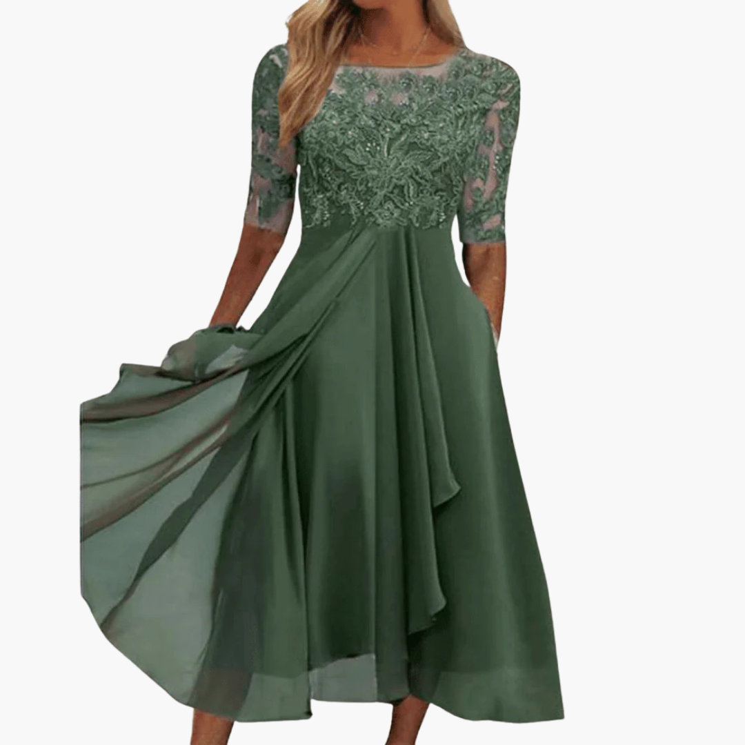 Elegant vardagsklänning dam, midi med korta ärmar. Rund hals, hög midja. Perfekt som sommarklänning.