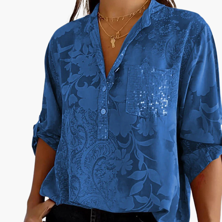 Elegant mönstrad blus med bröstficka och bekväm stretch för kvinnor. Ståkrage och kort ärm.