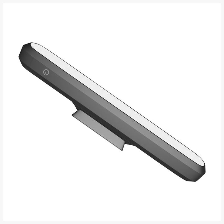 "Magnetisk uppladdningsbar bordslampa, kompakt design, magnetfot, justerbara ljusnivåer, svart eller vit färg."