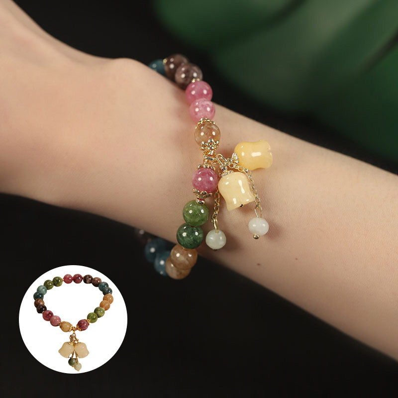 "Mångfärgat turmalin-armband för kvinnor, naturliga stenar, elegant och unikt designad smyckeaccessoar."