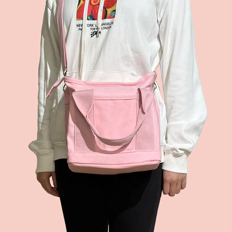 "Mångsidig kvinnors canvas handväska med flera fickor, rymlig design med dragkedja, perfekt för vardag och fest."