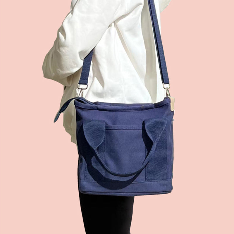 "Mångsidig kvinnors canvas handväska med flera fickor, rymlig design med dragkedja, perfekt för vardag och fest."
