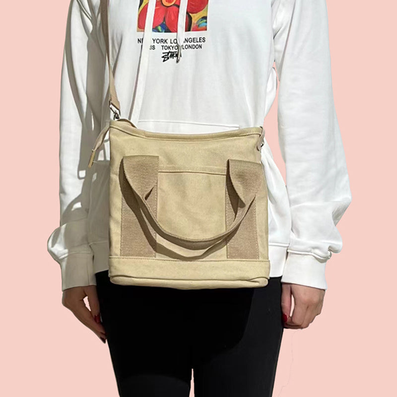 "Mångsidig kvinnors canvas handväska med flera fickor, rymlig design med dragkedja, perfekt för vardag och fest."