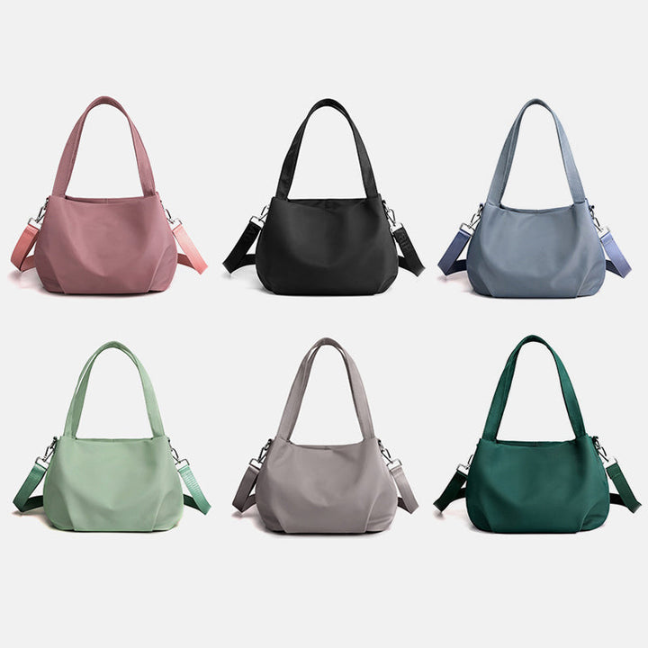 "Mångsidig nylon crossbody väska för kvinnor med ficka, justerbar rem och fler färgval, perfekt för vardag och resor."