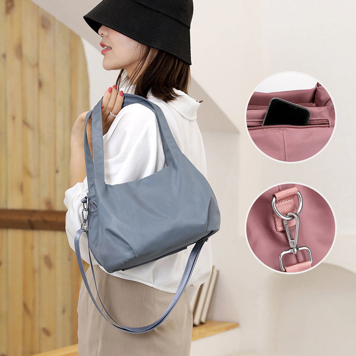 "Mångsidig nylon crossbody väska för kvinnor med ficka, justerbar rem och fler färgval, perfekt för vardag och resor."