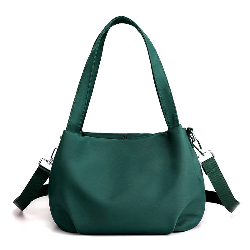 "Mångsidig nylon crossbody väska för kvinnor med ficka, justerbar rem och fler färgval, perfekt för vardag och resor."