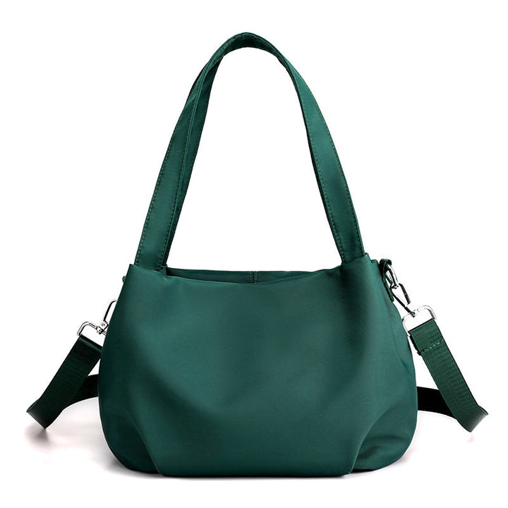 "Mångsidig nylon crossbody väska för kvinnor med ficka, justerbar rem och fler färgval, perfekt för vardag och resor."