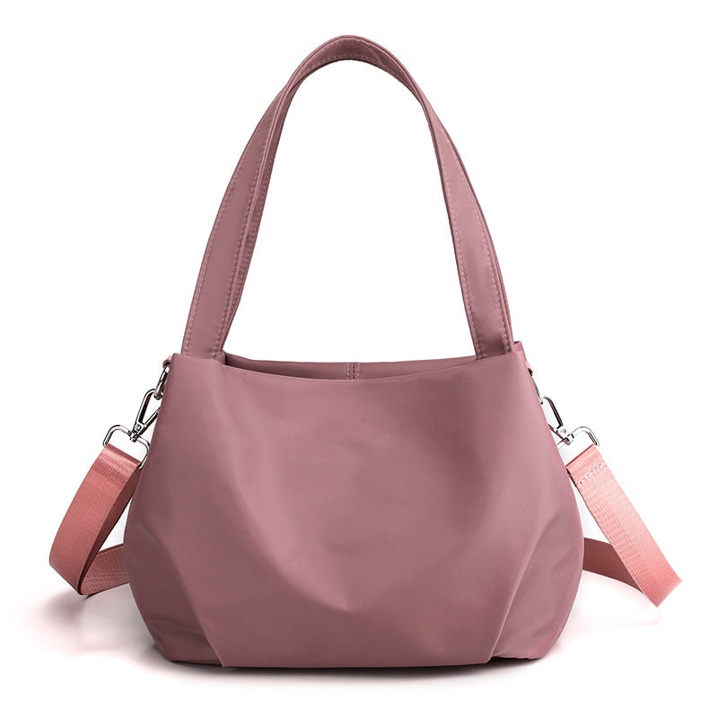 "Mångsidig nylon crossbody väska för kvinnor med ficka, justerbar rem och fler färgval, perfekt för vardag och resor."