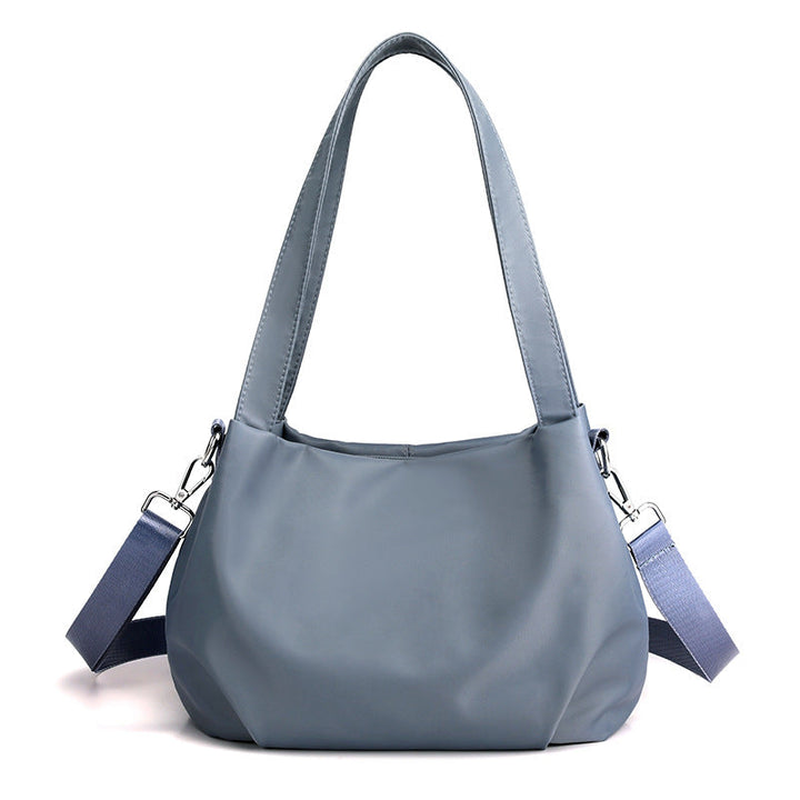 "Mångsidig nylon crossbody väska för kvinnor med ficka, justerbar rem och fler färgval, perfekt för vardag och resor."