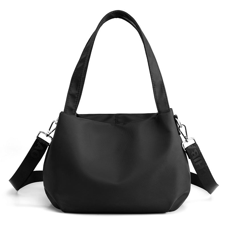 "Mångsidig nylon crossbody väska för kvinnor med ficka, justerbar rem och fler färgval, perfekt för vardag och resor."