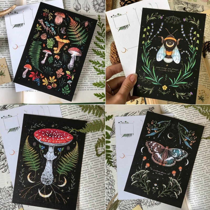 "Månkalender 2023 med mörka skogsmotiv, intrikata illustrationer, fångar natur och magi, fullmåne och stjärntecken."
