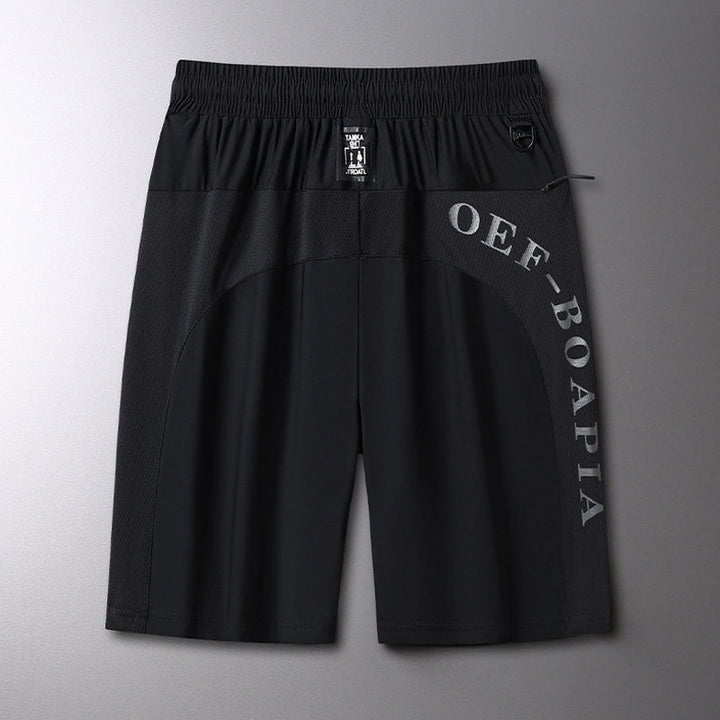 "Mäns sommar sportshorts med elastisk midja, avslappnad passform, svart färg, framifrån, lämplig för träning och vardag."