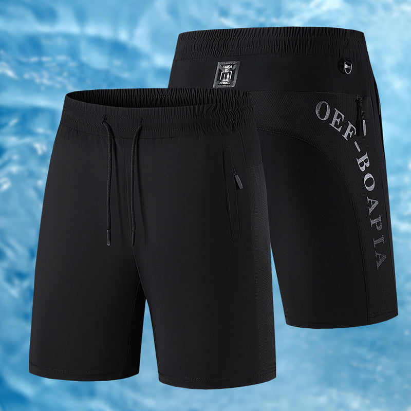 "Mäns sommar sportshorts med elastisk midja, avslappnad passform, svart färg, framifrån, lämplig för träning och vardag."