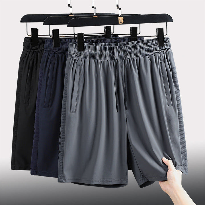 "Mäns sommar sportshorts med elastisk midja, avslappnad passform, svart färg, framifrån, lämplig för träning och vardag."