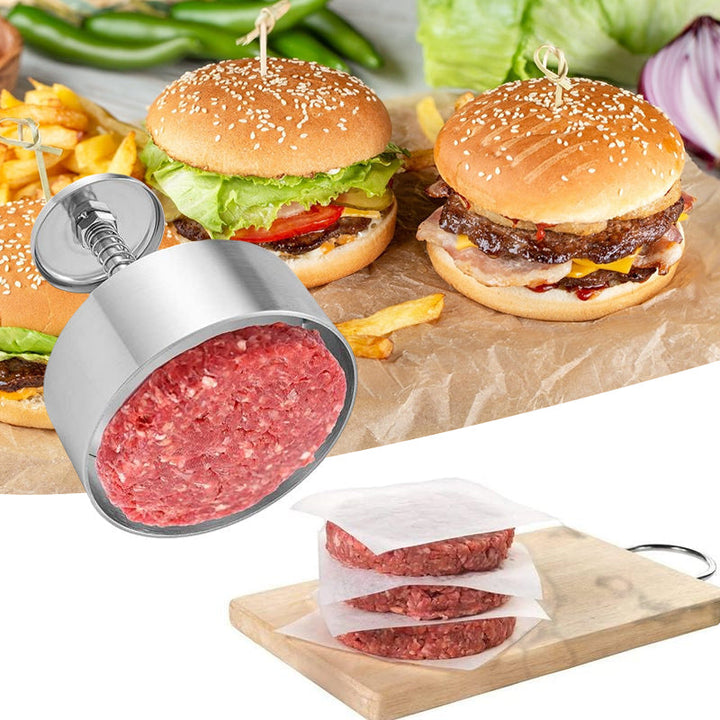 "Manuell köttpress i rostfritt stål, silverfärgad, ergonomisk design för perfekta hamburgerplättar, köksredskap."