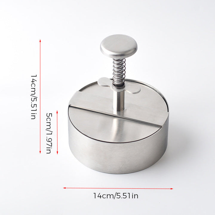 "Manuell köttpress i rostfritt stål, silverfärgad, ergonomisk design för perfekta hamburgerplättar, köksredskap."