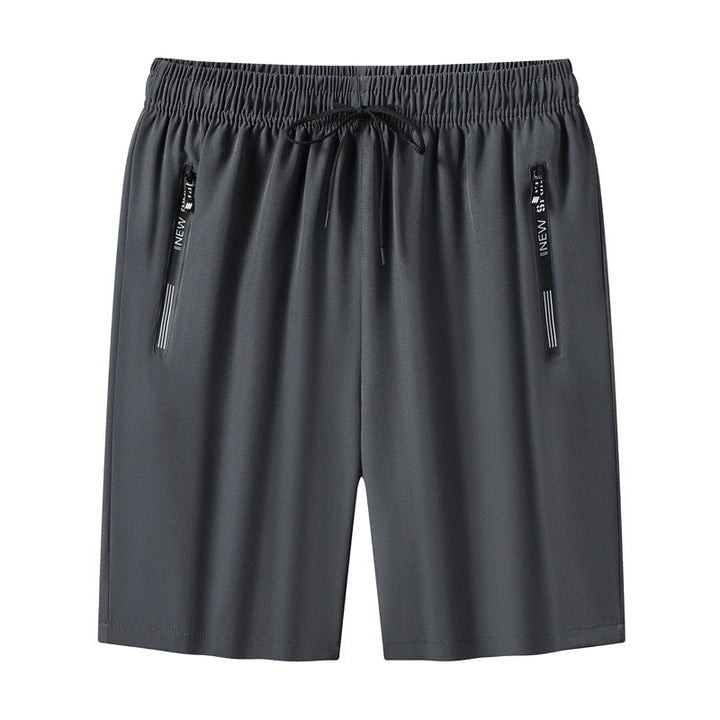 "Meshshorts för män i lätt material med elastiskt midjeband och fickor, perfekt för sommarens aktiva dagar."
