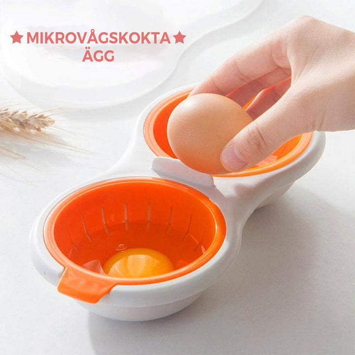 "Mikrovågsugn äggkokare i röd och vit plast, kompakt och portabel för snabb och effektiv äggtillagning."