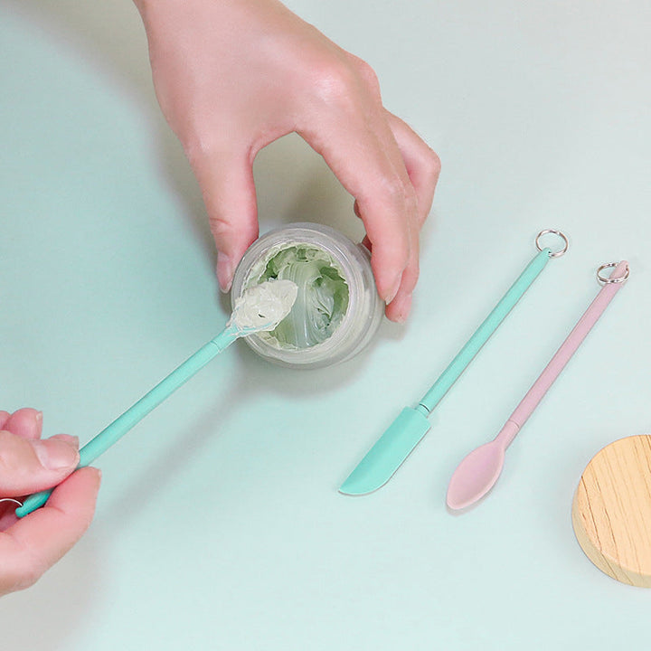 "Mini teleskopisk silikonspatel för kök, justerbar längd, ergonomiskt handtag, silikon och rostfritt stål, flerfärgad."