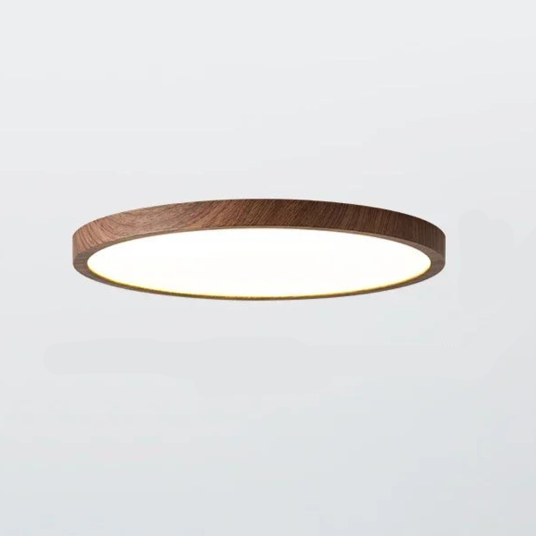 Minimalistisk rund taklampa med integrerad LED-belysning, perfekt för modern heminredning i vardagsrum.