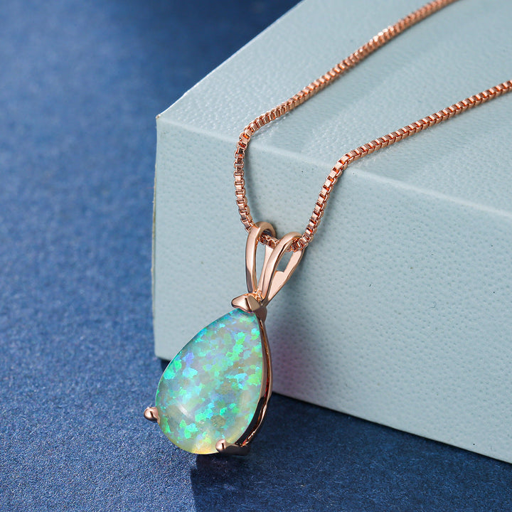 Tidlöst damhalsband med minimalistisk droppopal design, passar alla stilar.