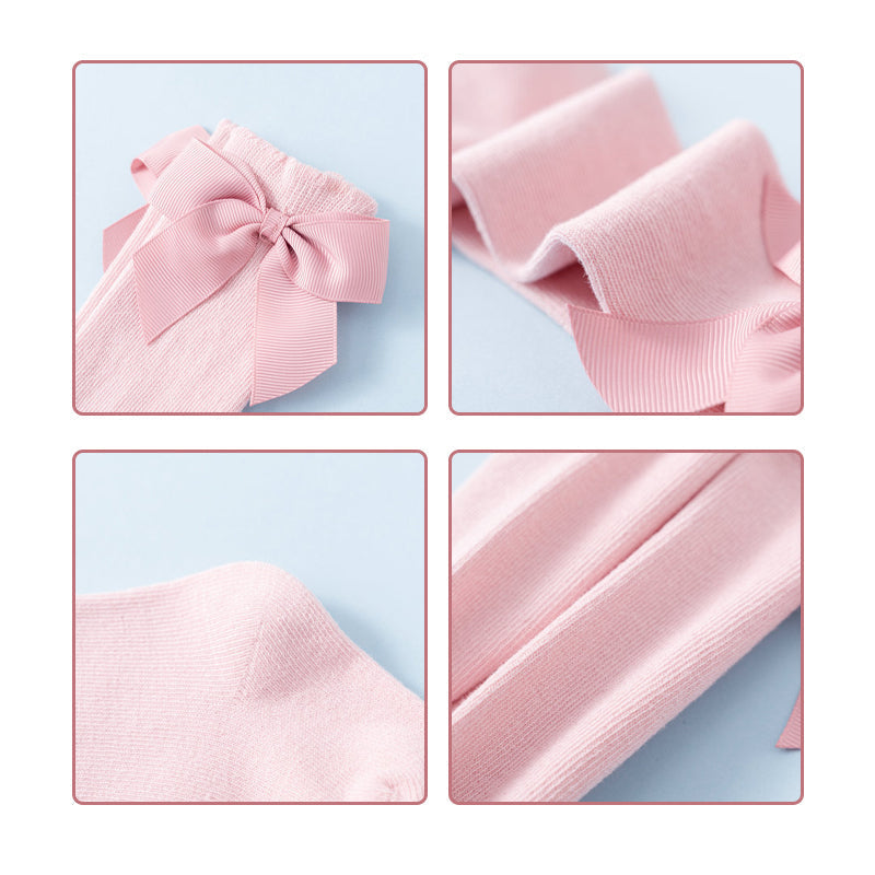 "Mjuka knähöga småbarnsstrumpor med söt rosett, idealiska för flickor. Perfekta för kyliga dagar och stilfulla outfits."
