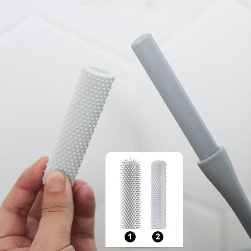 "Mjukt grå ergonomisk rengöringsborste för tåspalten med skonsamma borst, perfekt för effektiv fotvård."