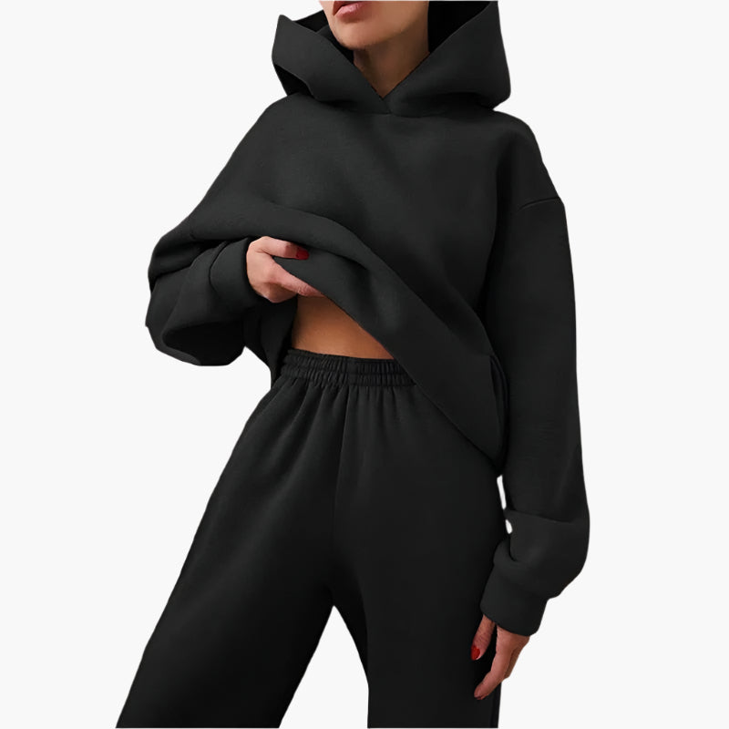 Bekvämt grått oversize lounge set för dam med mjuk hoodie och joggingbyxor, idealiskt för fritid & avkoppling.