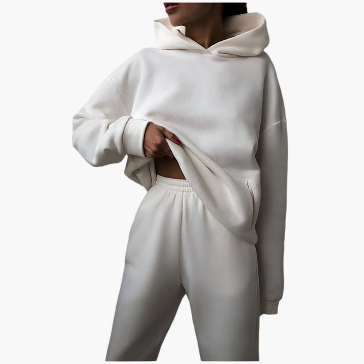 Vikbart grått oversize lounge set för dam med mjuk, rymlig hoodie och matchande joggingbyxor – ultimata myskläder.