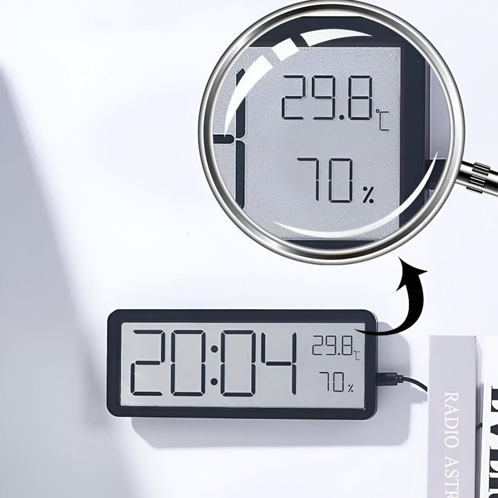 Smart digital LED-klocka med stor display. Mäter tid, temperatur och fuktighet. Perfekt för hemmet.
