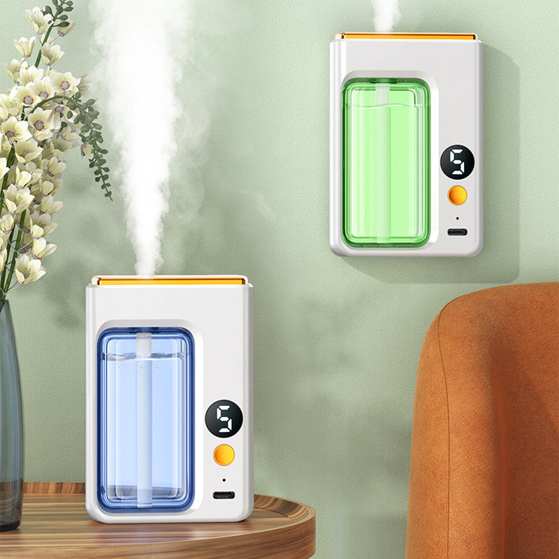 "Modern, kompakt automatisk aromaterapidiffusor, vit och stilren, för optimal doftspridning och lugn atmosfär."