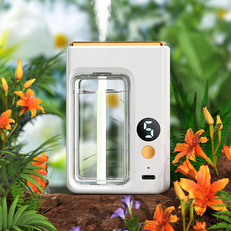 "Modern, kompakt automatisk aromaterapidiffusor, vit och stilren, för optimal doftspridning och lugn atmosfär."
