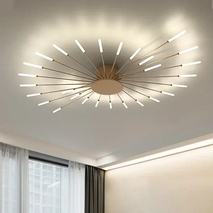 Stilren taklampa med solstrålar, svart LED belysning för modern inredning.