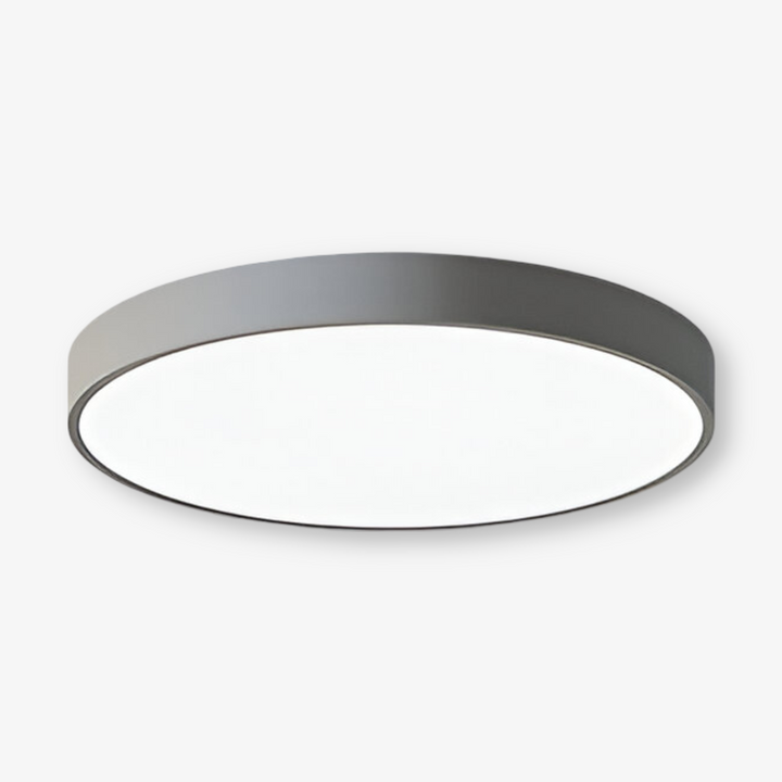 Modern rund LED taklampa, tunn design, ytmonterad takbelysning för jämn ljusspridning.