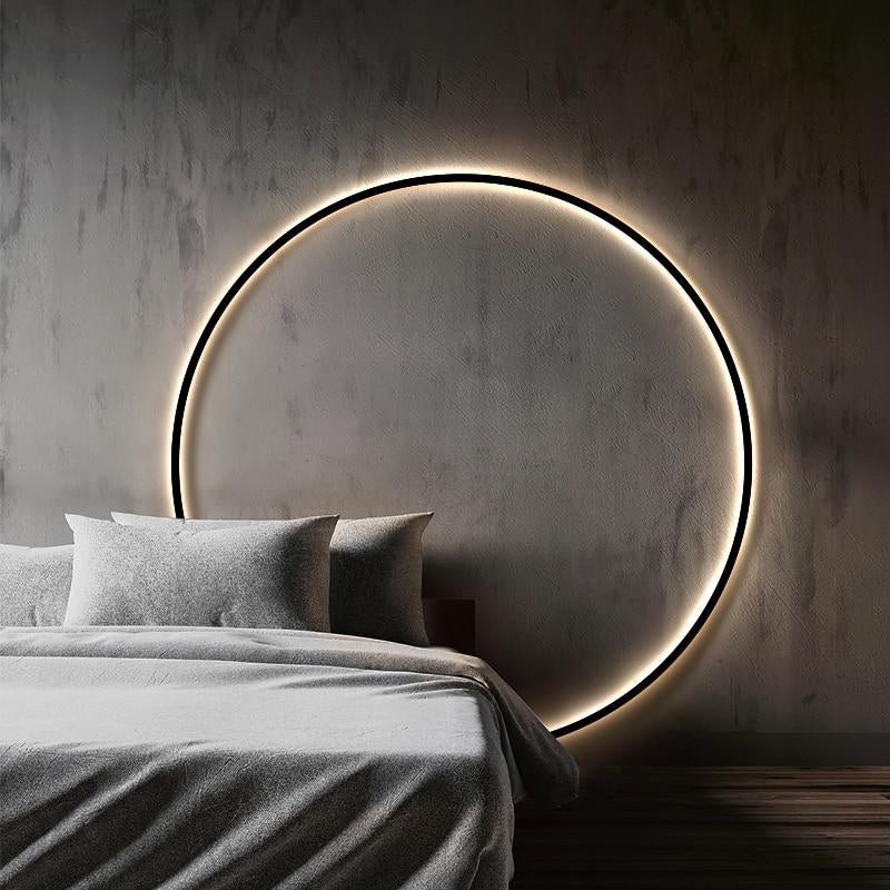 Modern svart rund LED-vägglampa för stilfull inomhusbelysning.