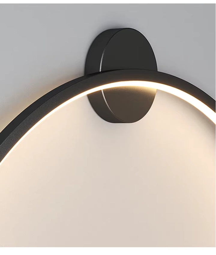 Rund svart vägglampa för modern atmosfärsbelysning, med energieffektiv LED.