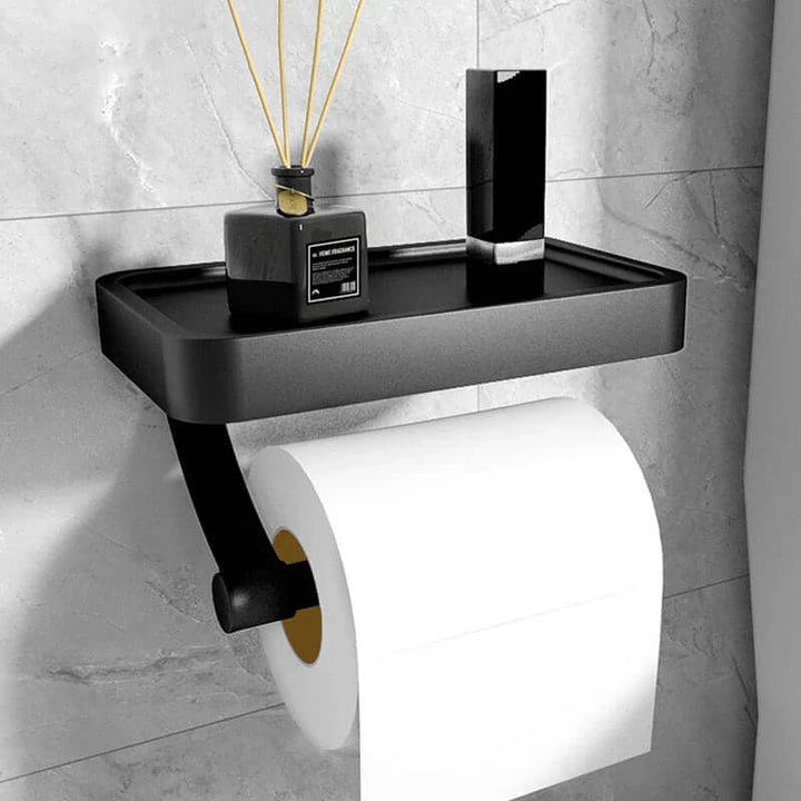 Modern WC-pappershållare i rostfritt stål med praktisk hylla för badrumsförvaring. Väggmonterad design.
