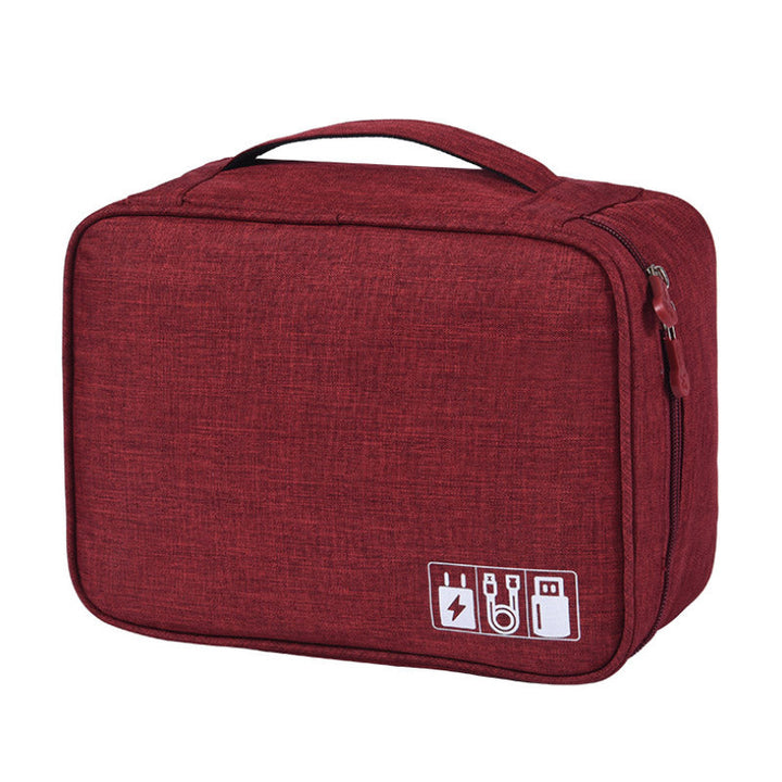 "Multifunktionell kabelförvaringspåse i vattentätt tyg med nätfickor, elastiska öglor för kablar och tillbehör."