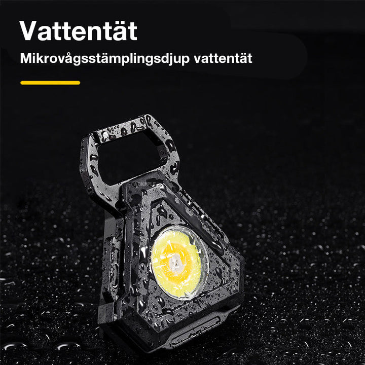 Multifunktionell LED-nyckellampa med stark magnet och krok, kompakt design, bärbar och perfekt för utomhusbruk.