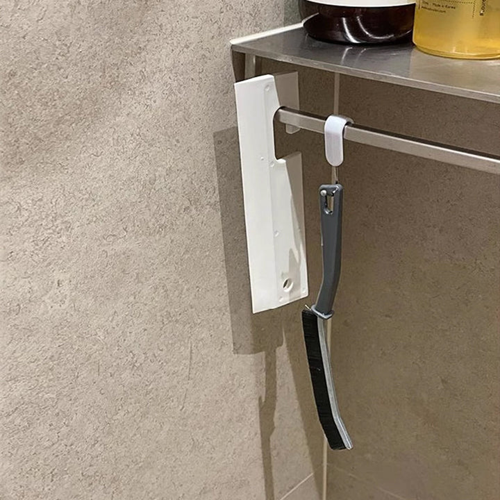 Multifunktionell rengöringsborste med robusta borst och ergonomiskt handtag för svåråtkomliga ytor; perfekt för hem och bil.