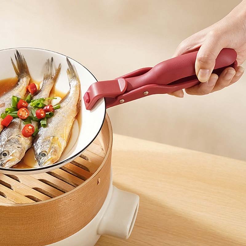"Multifunktionell skålklämma i grön och röd för säkert grepp; modern design för alla skålstorlekar, halkfri och justerbar."