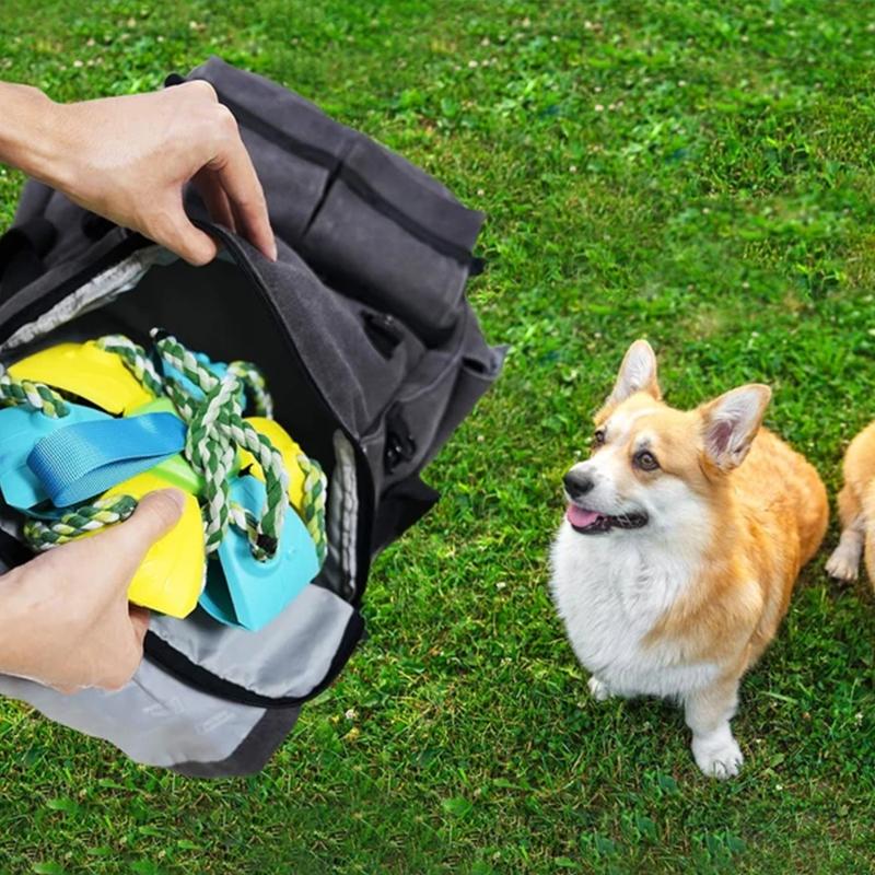 "Multifunktionell tuggig UFO-boll för hundträning med färgglada rep och gummiyta, perfekt för interaktiv lek utomhus."