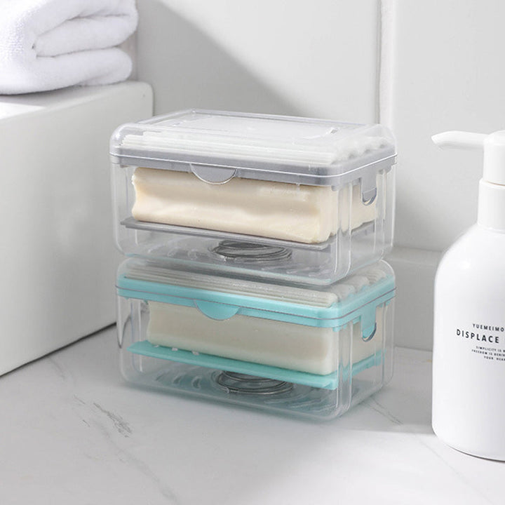 "Multifunktionell tvållåda i grå och blå, kompakt för badrum, med bubbelgenerator och anti-glid, hållbart PP-material."